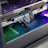 A close-up view of the interior of a computer casing showcasing a high-end graphics card with 'GeForce RTX' branding. The graphics card is secured in its slot, and several power cables are attached. The background reveals cooling fans illuminated with RGB lighting.